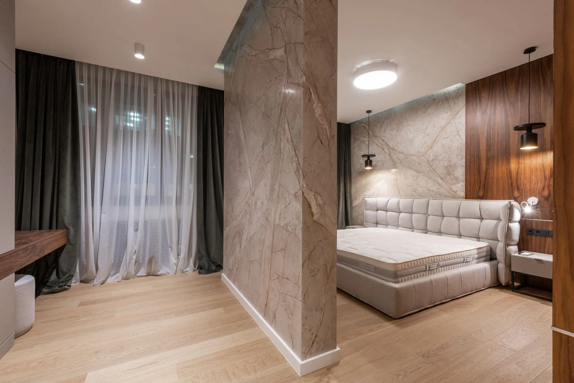 Principal bedroom with a stone feature wall